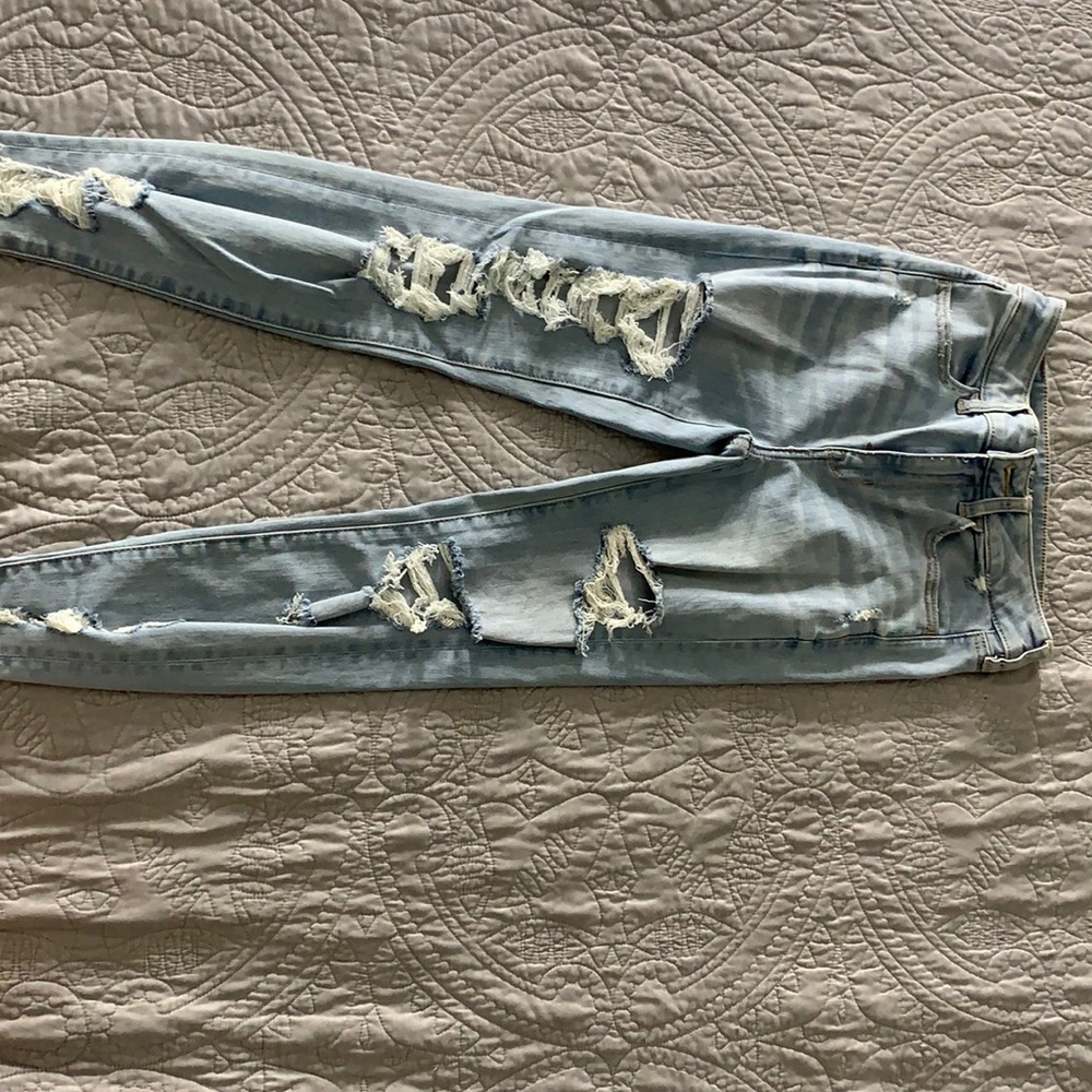 light blue ripped jeans